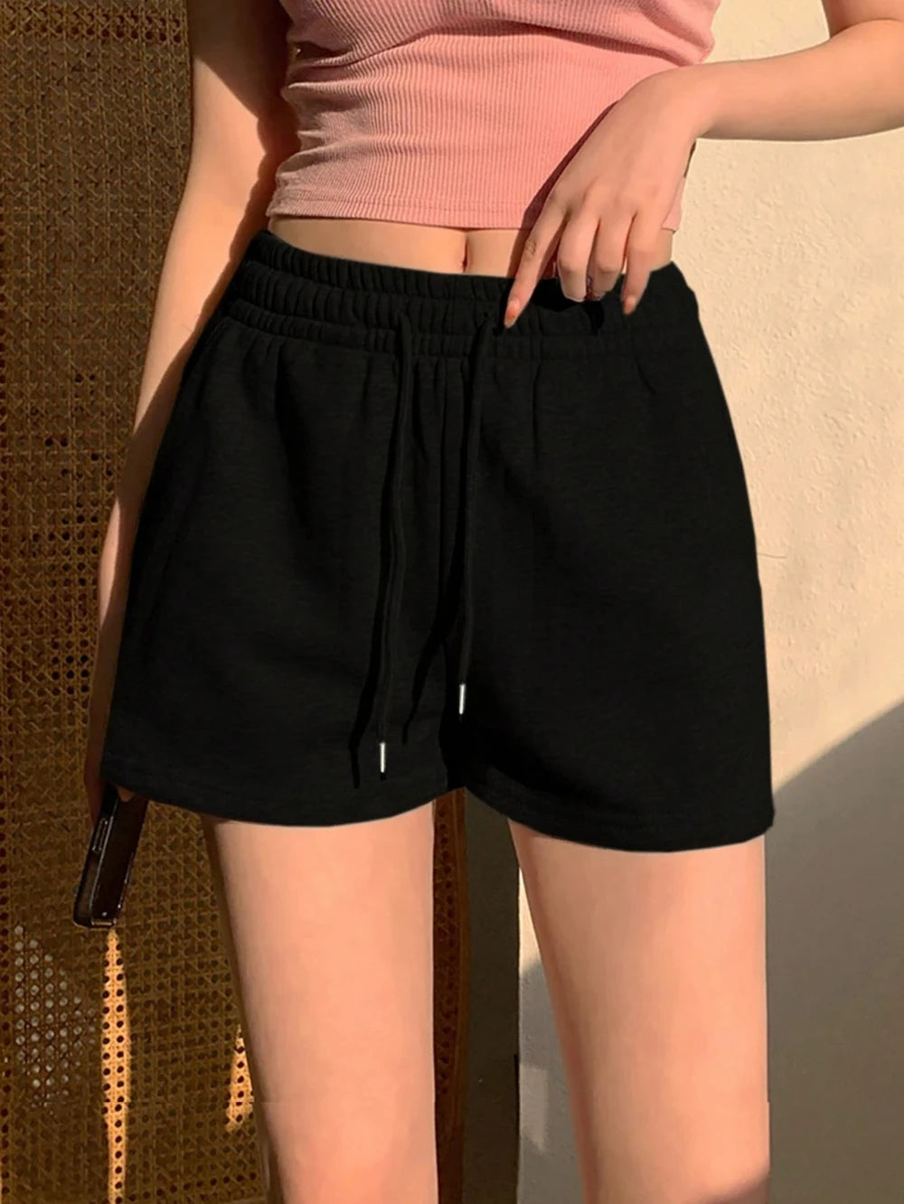 Women's solid color drawstring casual shorts, an ideal choice for everyday summer wear. Stylish loose-fitting athletic pants